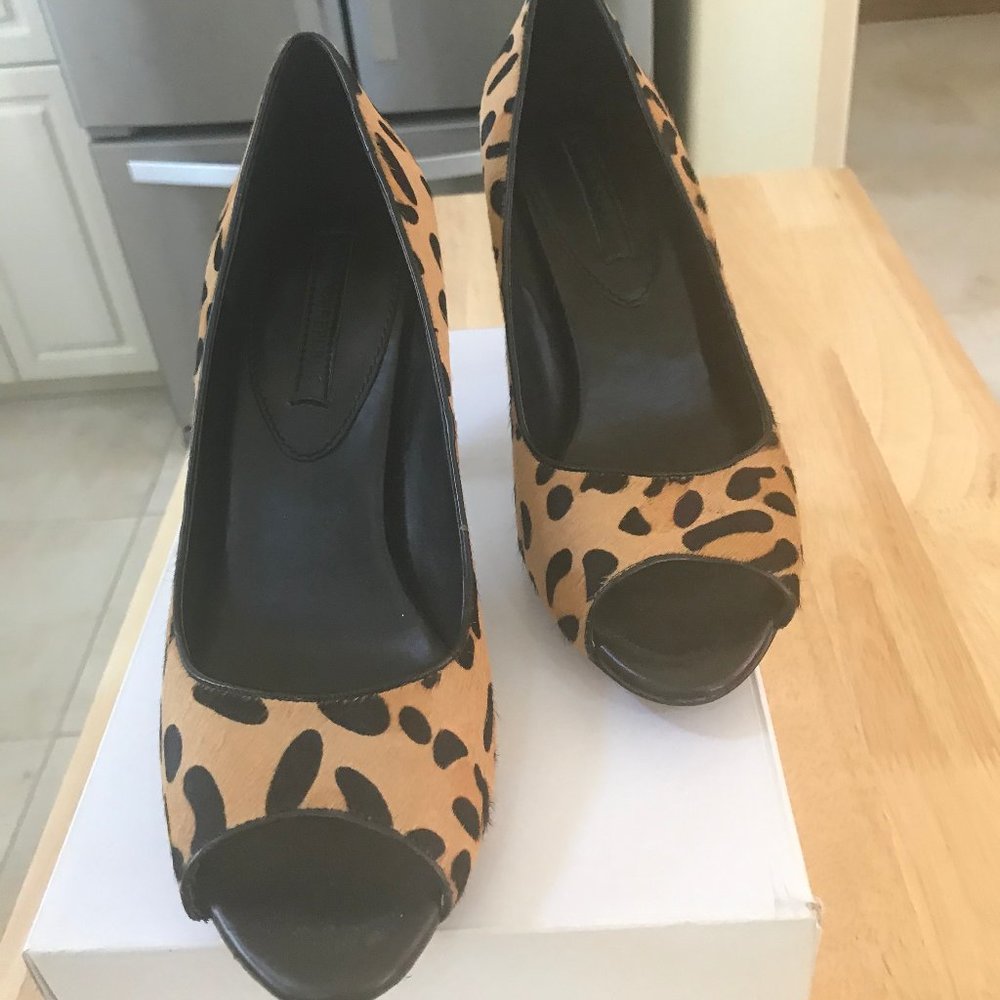Leopard print open toe heel.